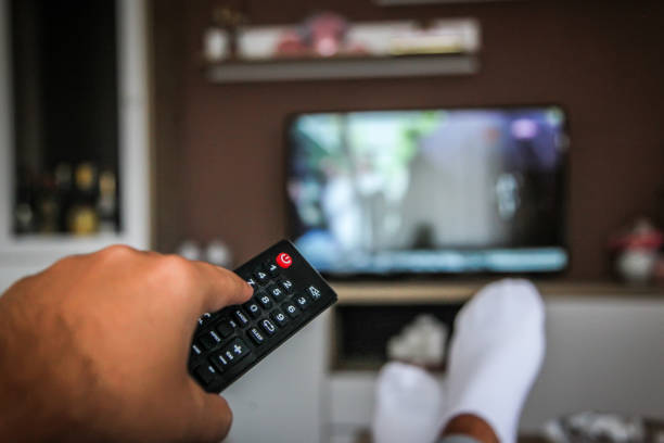 istock Looking the tv at home 1032614690