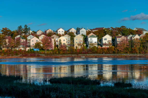 istock Houses on a Pond in Autumn 1032616990