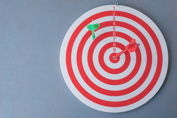 istock Close-Up Of Dartboard Against Gray Background 1032622138