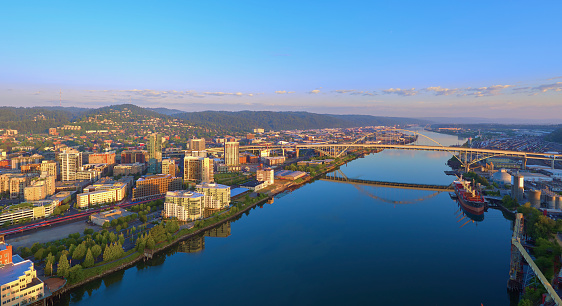 Aerial sunrise of the Fremont Bridge and the waterfront in downtown Portland Oregon on a sunny summer day