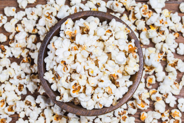 istock Salt popcorn on the wooden table, 1032637130