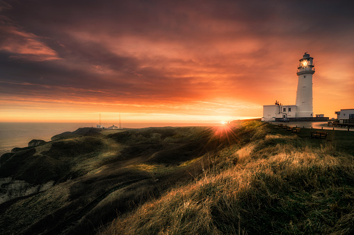 Flamborough Lighthouse, Yorkshire, UK\nTaken at sunrise during winter. It lasted only for 10 minutes before the sun rose above the thick blanket of clouds to start a miserable winters day.