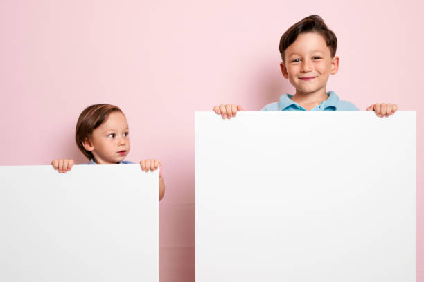 istock Children are holding white poster. 1032650960