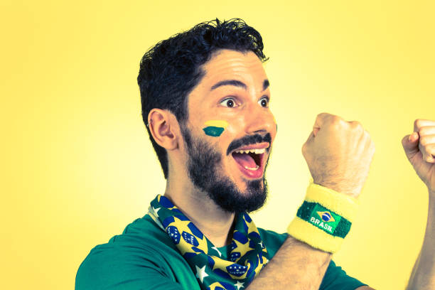 istock Happy Man Cheering Against Yellow Background 1032651284