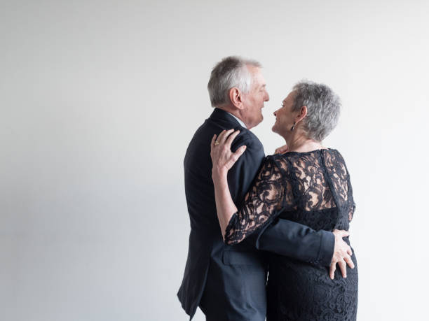 istock Senior Couple Dancing Against White Background 1032651290