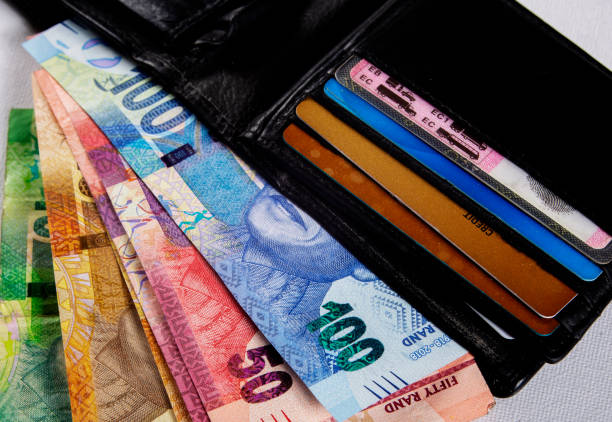 South African Rands South African Rand in a black wallet african currency stock pictures, royalty-free photos & images