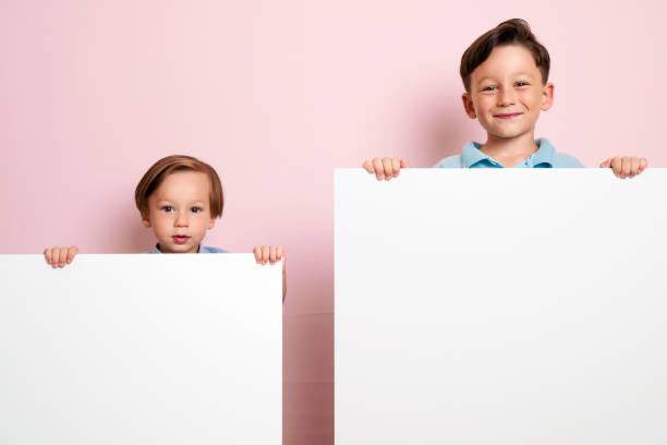 istock Children are holding white poster. 1032651398