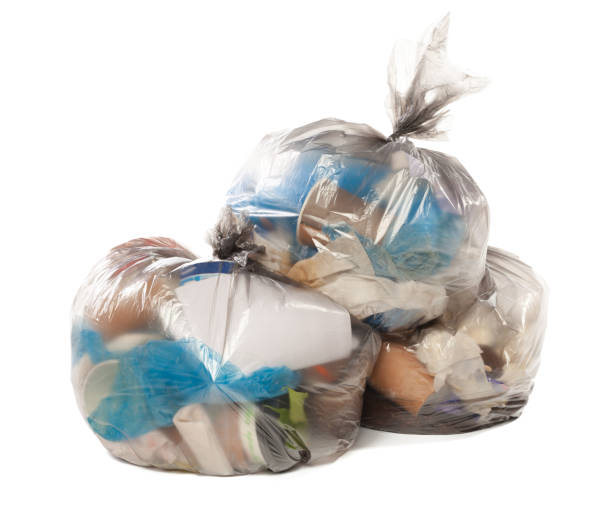 istock Plastic bag full of rubbish on isolated white background 1032654014
