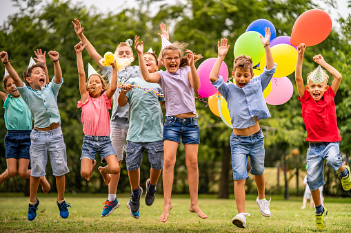 a group of children celebrate their birthday and they all bounced at the same time