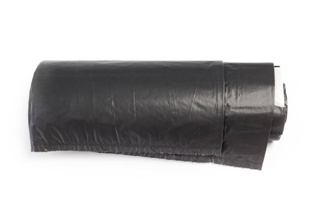 istock roll of plastic garbage bags isolated on white background 1032655504
