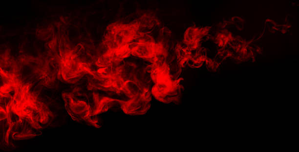 czerwony dym na ciemnym tle – zdjęcie