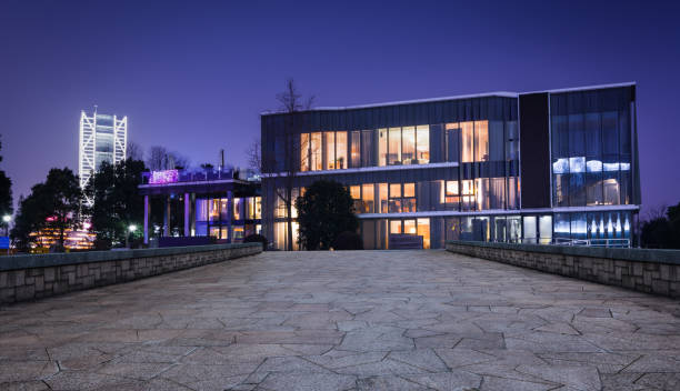 istock ecological energy saving wooden office building at night 1032659174