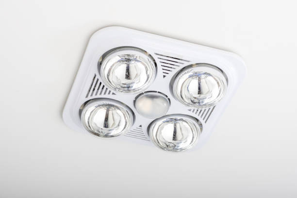istock Four lamp bathroom heater isolated on white ceiling. 1032661372