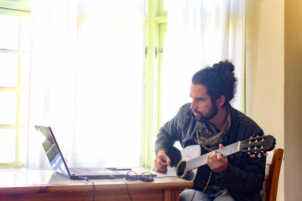 istock Man and Guitar 1032670564