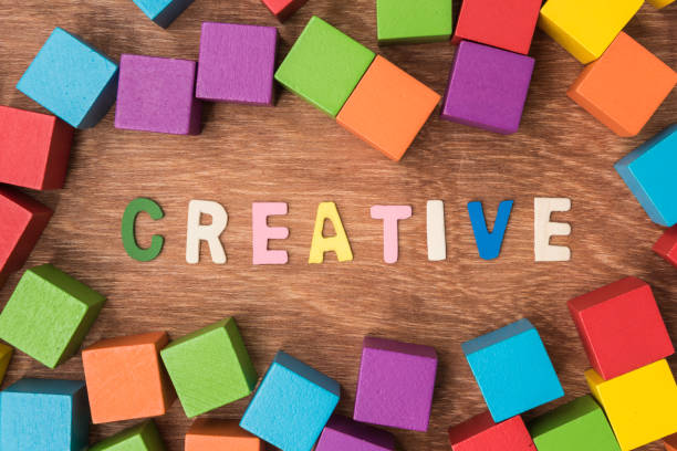 istock High Angle View Of Multi Colored Toy Blocks By Text On Table 1032673562