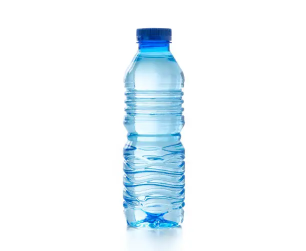 Photo of water in plastic bottle on isolated white background