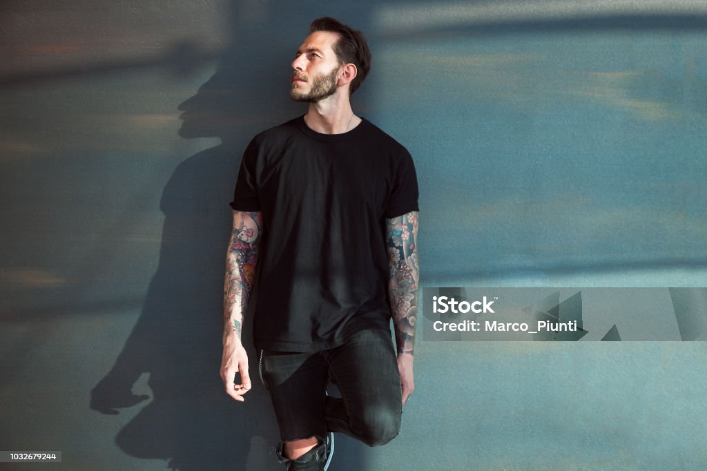 Portrait of tattooed young man T-Shirt Stock Photo