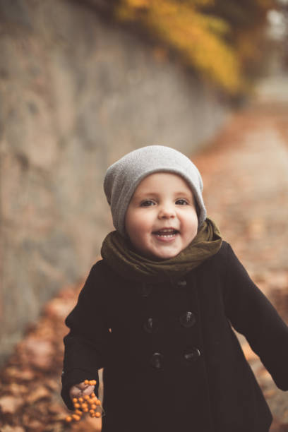 istock Cute Little Girl Enjoying Fall Season 1032682382