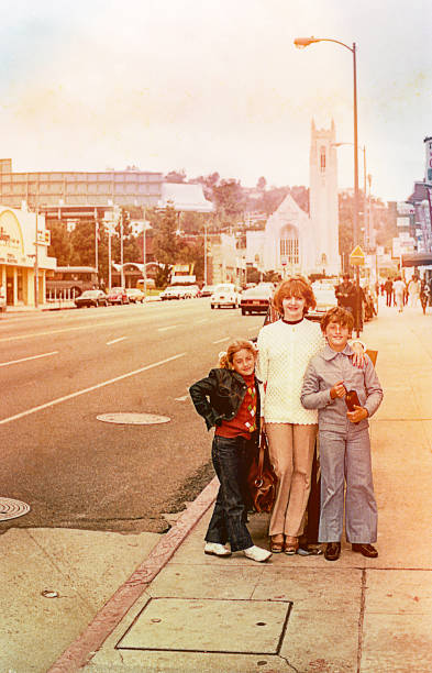 istock Mother and children on a street 1032686982