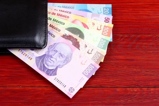istock Mexican Pesos in the black wallet 1032693670