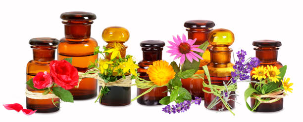 Old pharmacist glass bottles with medical plants