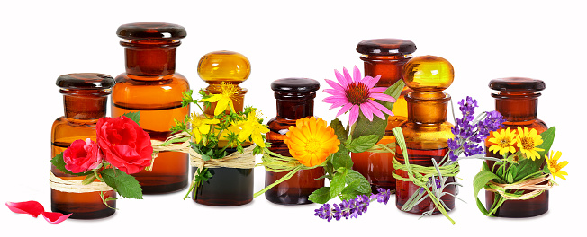 Alternative medicine and cosmetics in old glass Apothecary bottles, isolated