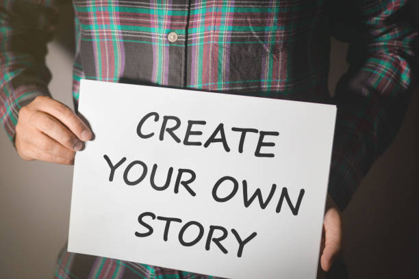 istock Young man storyteller showing a white board with text: CREATE YOUR OWN STORY 1032698280