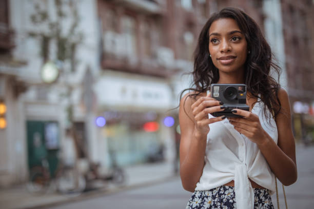 istock Black woman photographer 1032698982