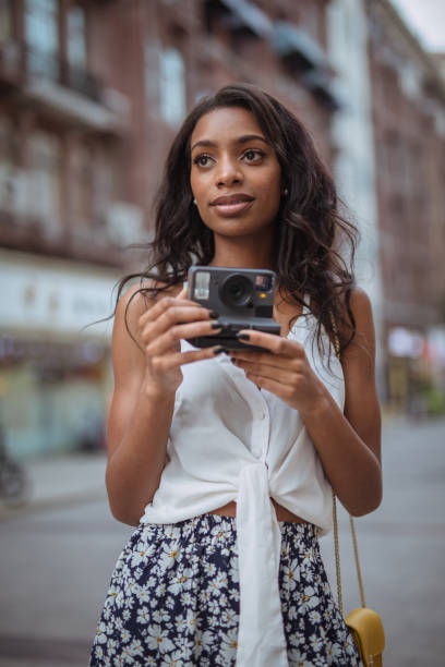 istock Black lady photographer 1032699372