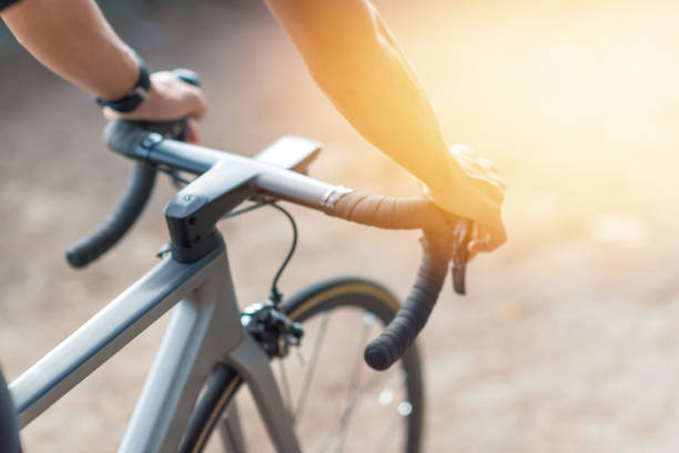 istock Young asian cyclist man ride  bicycle  the beach at the sunset 1032704006