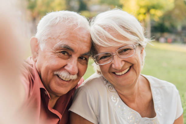 istock Smiling old couple taking a selfie 1032704454