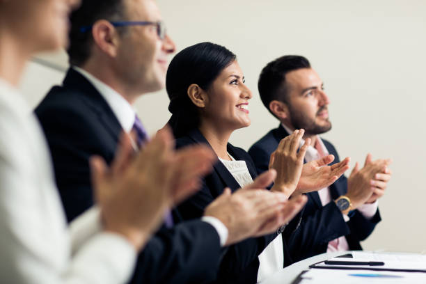 istock Latin business executives sitting and clapping 1032707758