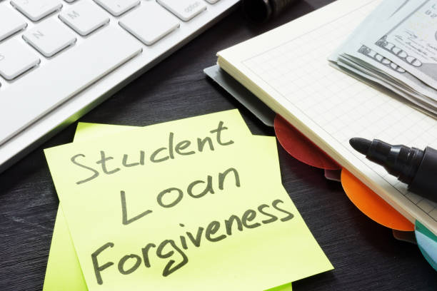 istock Student loan forgiveness written on a memo stick. 1032708832