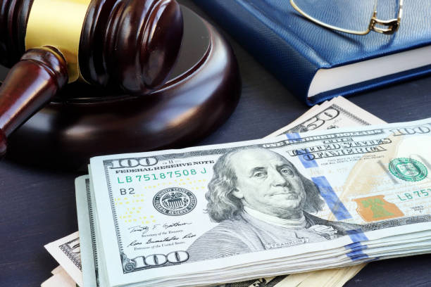 Litigation finance. Gavel and dollar banknotes. Bail bonds. Litigation finance. Gavel and dollar banknotes. Bail bonds. cricket stump photos stock pictures, royalty-free photos & images