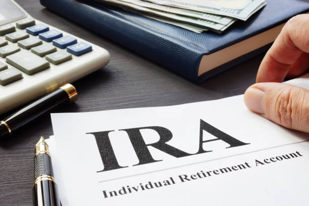 Documents about Individual retirement account IRA on a desk. Documents about Individual retirement account IRA on a desk. pension photos stock pictures, royalty-free photos & images