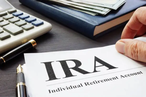 Photo of Documents about Individual retirement account IRA on a desk.