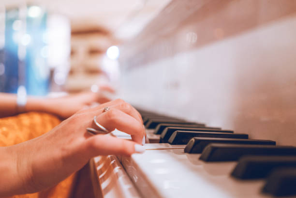istock Woman plays piano 1032728588
