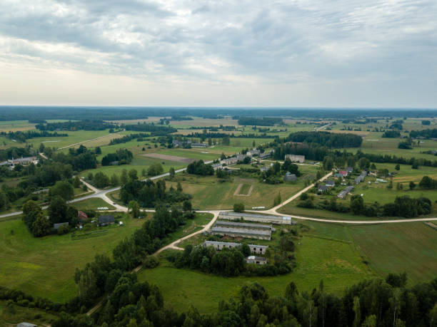 istock drone image. aerial view of rural area with fields and forests. camping housing rooftops 1032739924