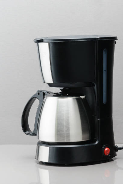 istock Coffee machine with pot on the grey mirror background. 1032753424