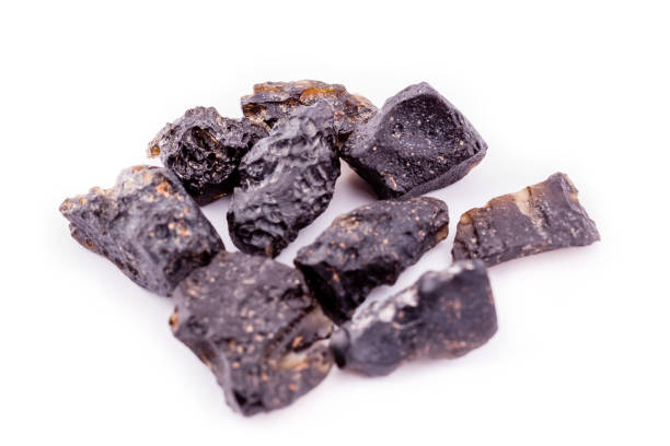 istock Macro mineral stone Tectites on a white background close up 1032758290