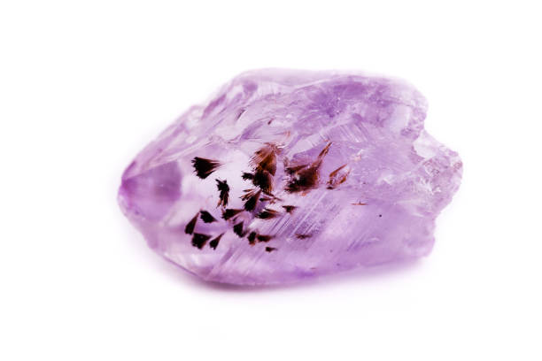 Macro Mineral Stone Amethyst on a white background close up