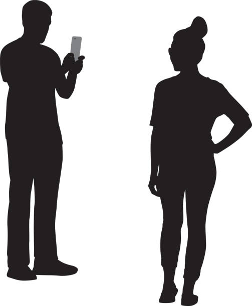 Young Man Photographing Girl Silhouette Vector illustration of a young man photographing a girl with his smart phone. black and white portrait photographers stock illustrations