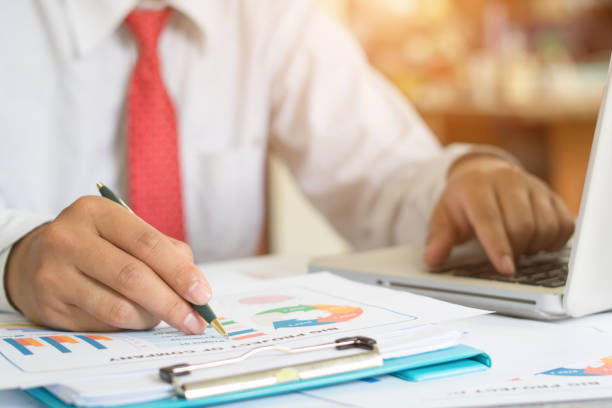istock Young businessmen using notebook and writing business plan for meeting preparation in office. 1032782290