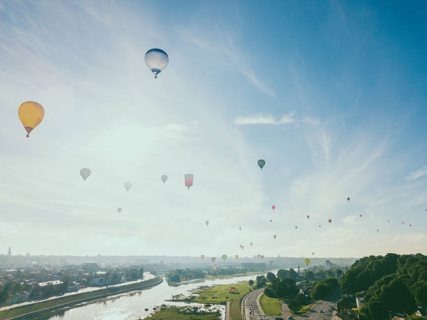 istock Hot Air Balloons Flying Against Sky 1032790586