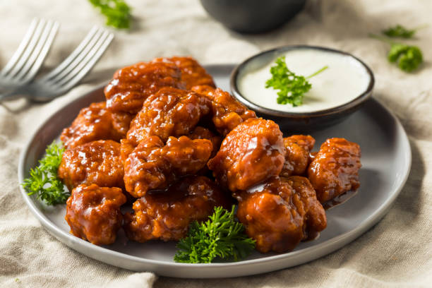 Barbecue Boneless Chicken Wings Barbecue Boneless Chicken Wings with Blue Cheese nuggets heat stock pictures, royalty-free photos & images