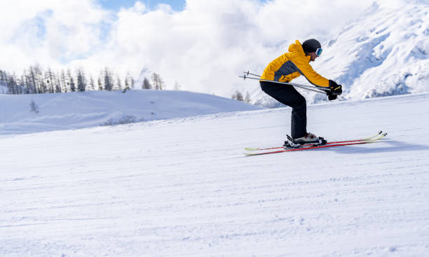 istock Happy man skiing in the Alps 1032803232