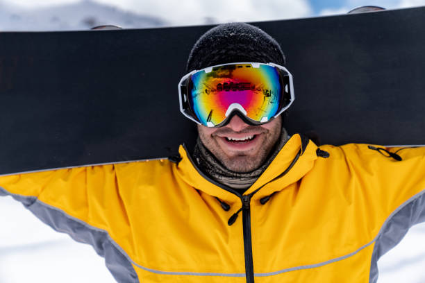 istock Portrait of a happy snowboarder 1032803320