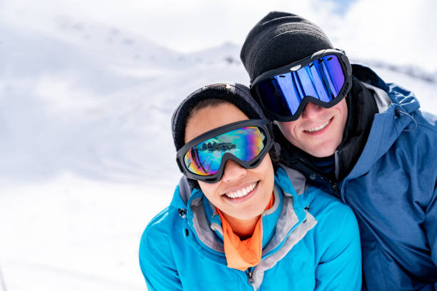 istock Happy couple having fun skiing in the Alps 1032803328