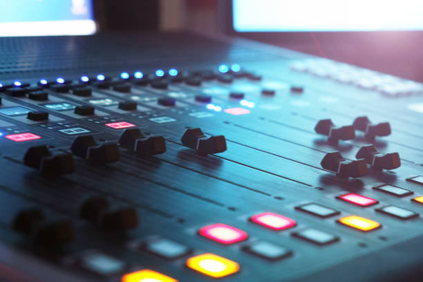 istock The audio mixer in the Studio, the handles move up and down, all ready to record. 1032803896
