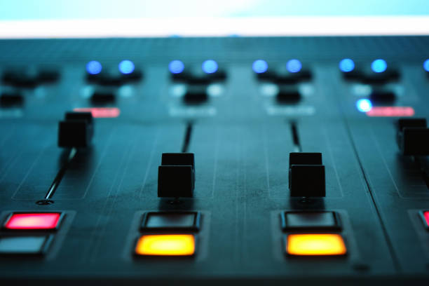 istock The audio mixer in the Studio, the handles move up and down, all ready to record. 1032803932